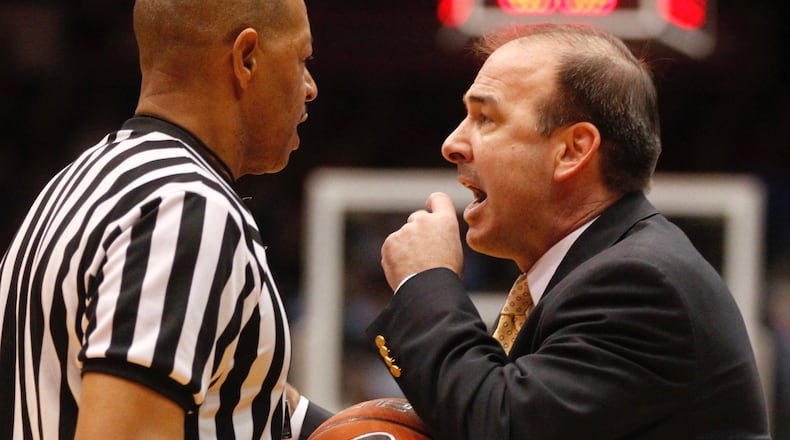 George Washington coach Mike Lonergan argues a call with an official on Saturday, Feb. 1, 2014, at UD Arena. David Jablonski/Staff