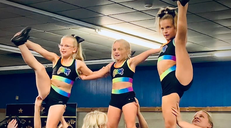 Young cheerleaders at Celebrity Athletics in Xenia practice their stunts Tuesday, Sept. 26, 2023 LONDON BISHOP/STAFF