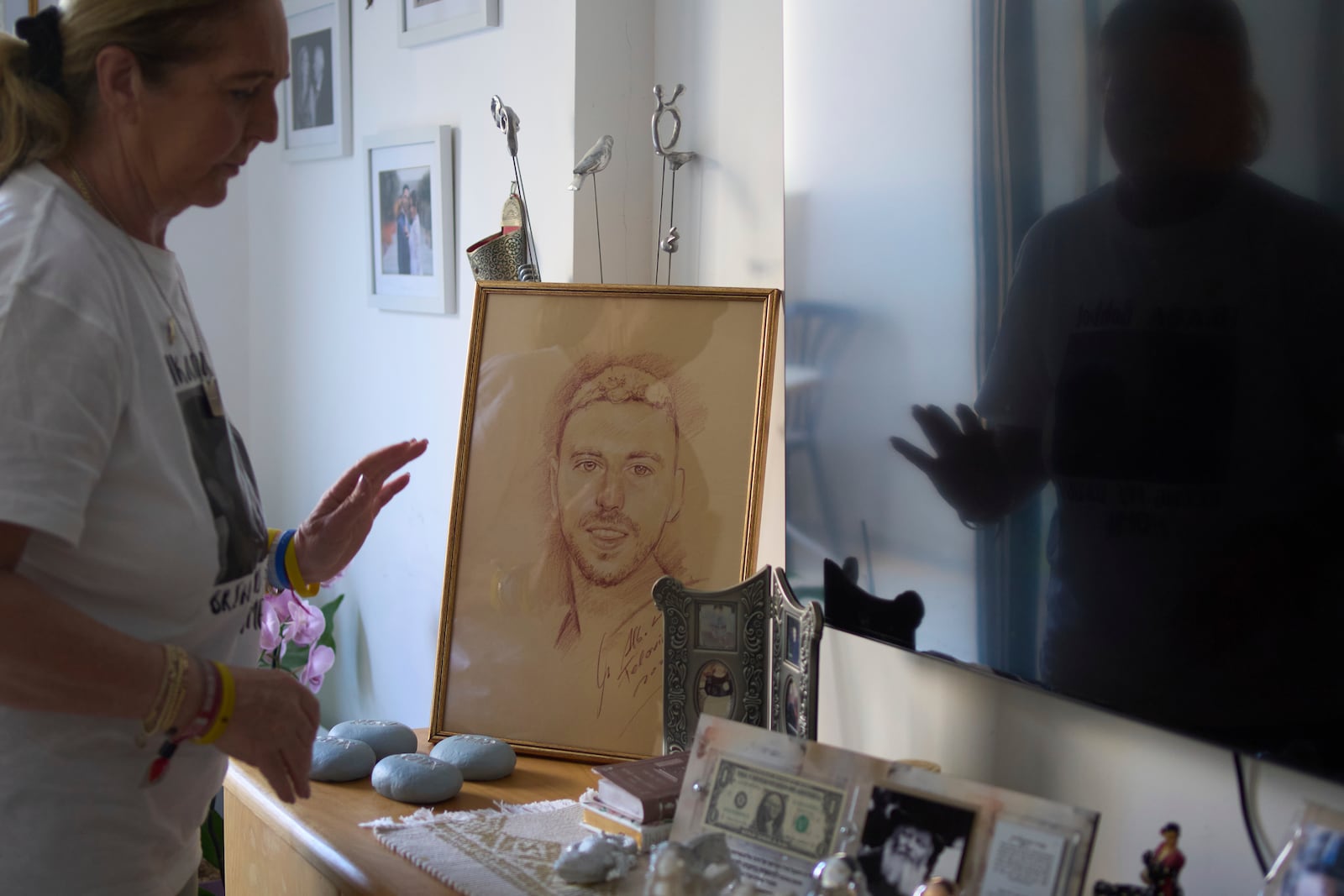 Ruhama Bohbot, mother of hostage Elkana Bohbot, has a picture of her son on display at her home in Mevaseret Zion, Israel, Wednesday, May 7, 2025. (AP Photo/Maya Alleruzzo)