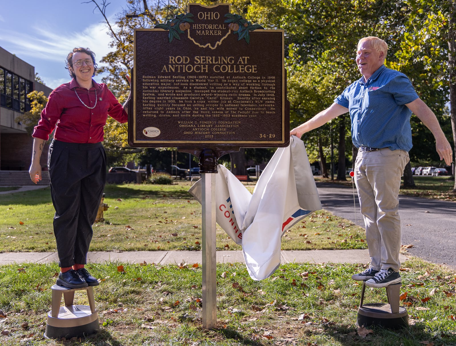 River Esquivel, an Antioch College student and filmmaker, and Scott Sanders, Antioch College archivist, unveil an Ohio Historical Marker for Rod Serling on Thursday, Oct. 2 at Antioch College. BRYANT BILLING / STAFF