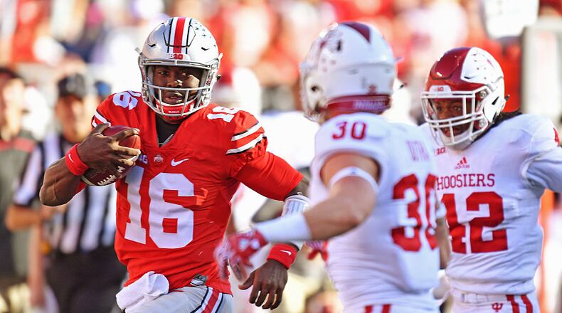 COLUMBUS, OH - OCTOBER 8: Quarterback J.T. Barrett #16 of the Ohio State Buckeyes picks up 27 yards in the second quarter against the Indiana Hoosiers to set up the Buckeyes’ second touchdown at Ohio Stadium on October 8, 2016 in Columbus, Ohio. (Photo by Jamie Sabau/Getty Images)