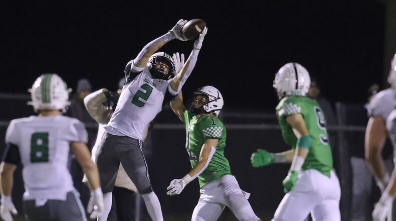 Celina's Zander Jones is defended by Badin's Aidan Brown during their D-III regional football final Friday, Nov. 17, 2023 at Trotwood-Madison High School. Celina won 37-25. NICK GRAHAM/STAFF