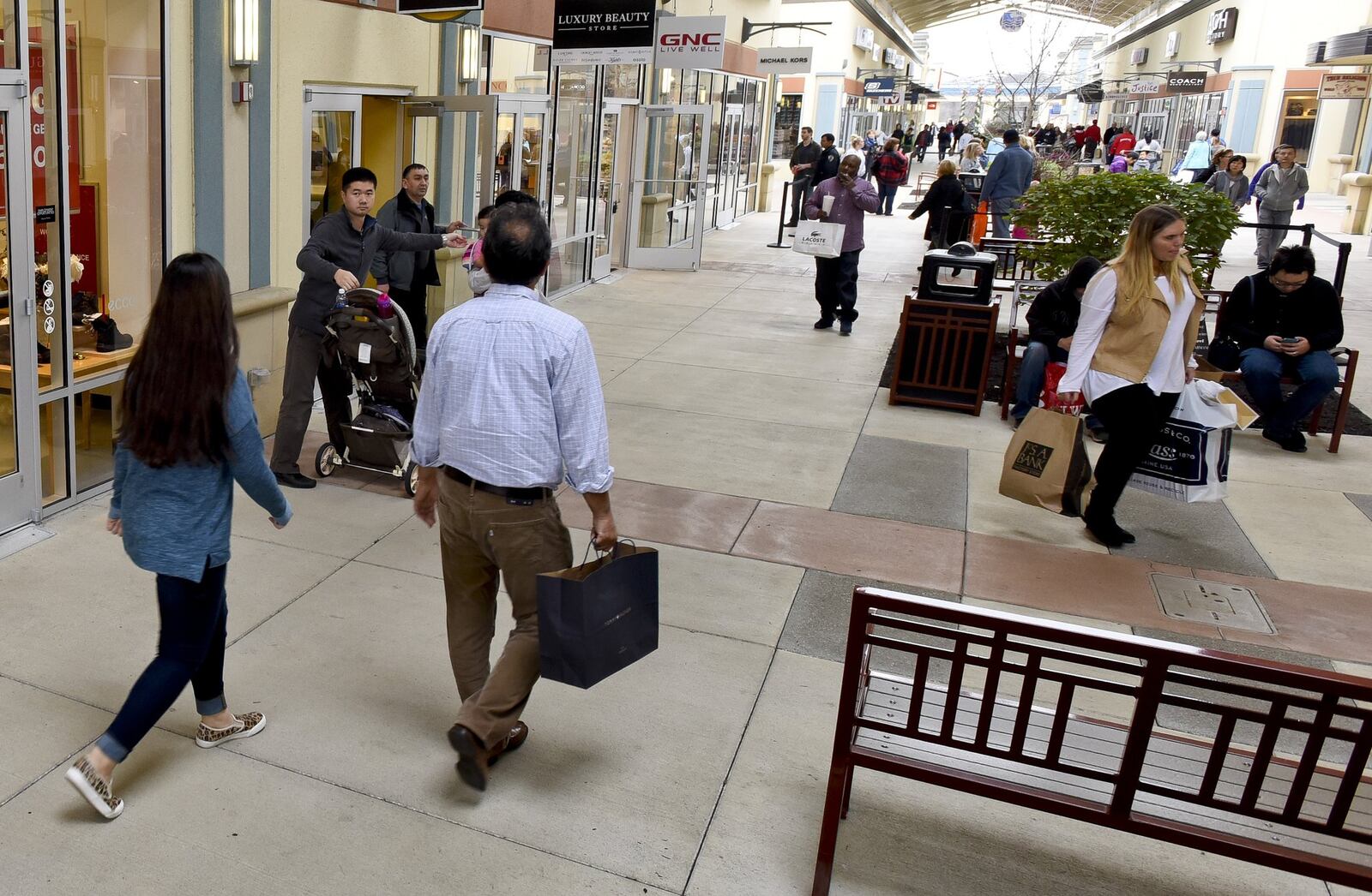 Shoppers look for Black Friday deals at Cincinnati Premium Outlets in Monroe. NICK GRAHAM/STAFF