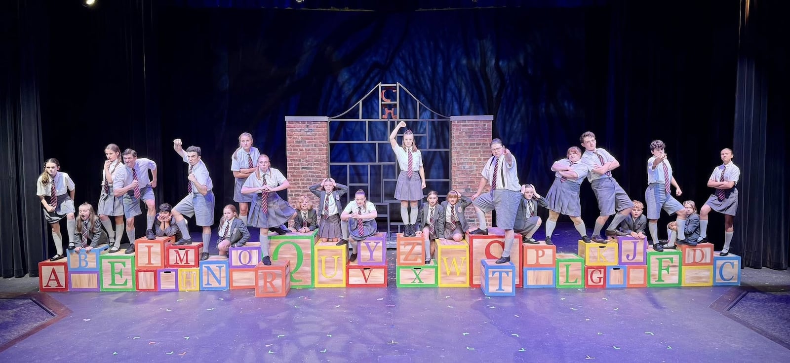 The ensemble of La Comedia Dinner Theatre's production of "Matilda: The Musical" perform "School Song." PHOTO BY JUSTIN WALTON