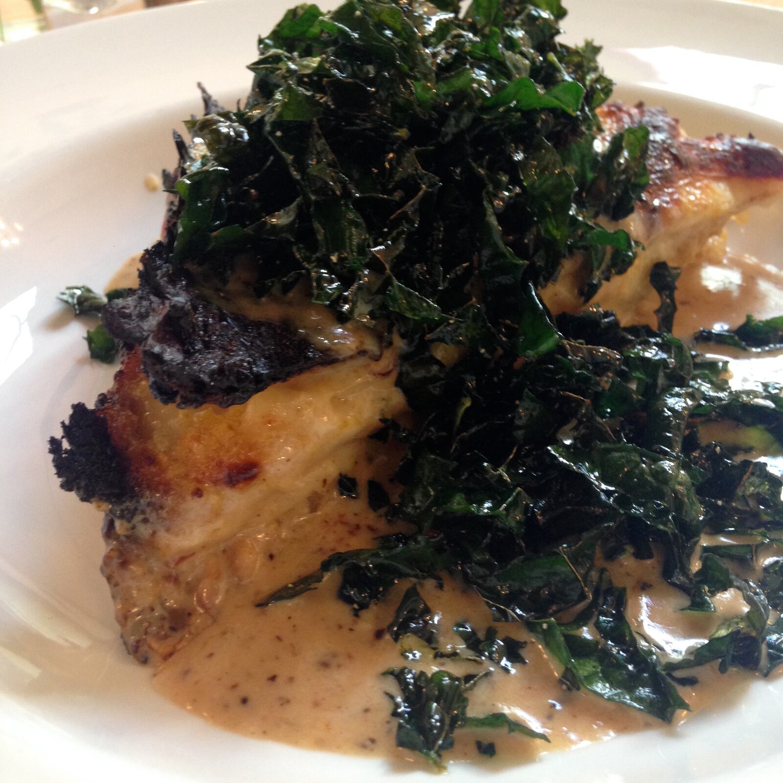 Butternut squash lasagna with ricotta cheese, sage leaves, crispy kale and roasted garlic cream sauce ($19). (Source: Lily’s Bistro)
