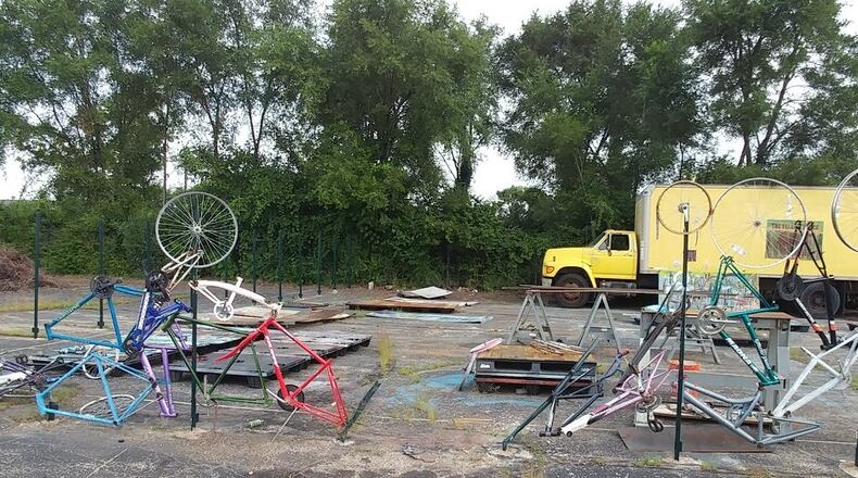 Damage to a sculptural fence made of bike parts at the Dayton Life Enrichment Center