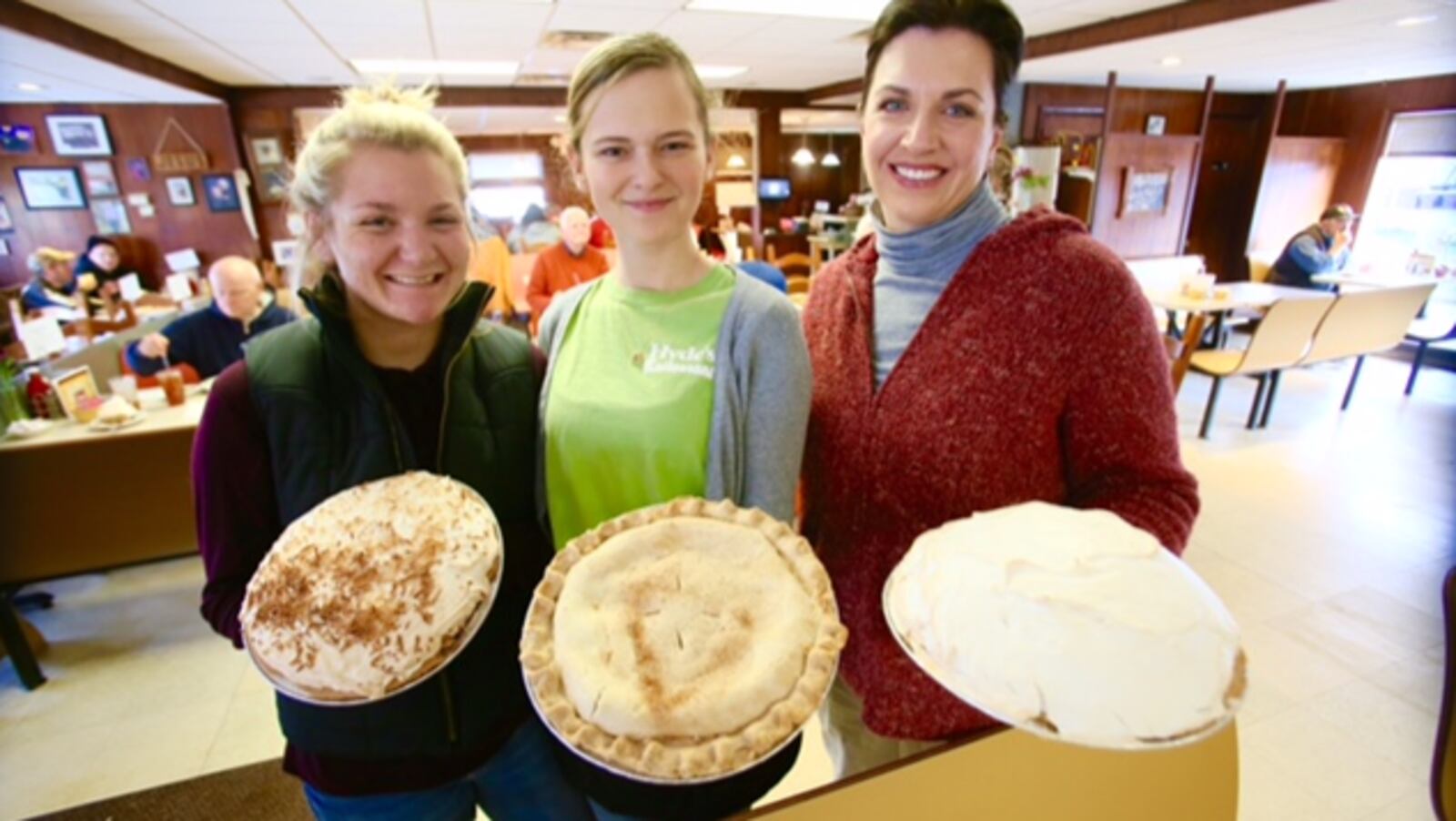 Tarin Lauer, Audrey Amburgy, and Co-owner Amy Hyde-Klaiber stand with coconut, apple and banana cream pies at Hydes Restaurant in Hamilton on Pi Day, Tuesday, Mar. 14. GREG LYNCH/STAFF