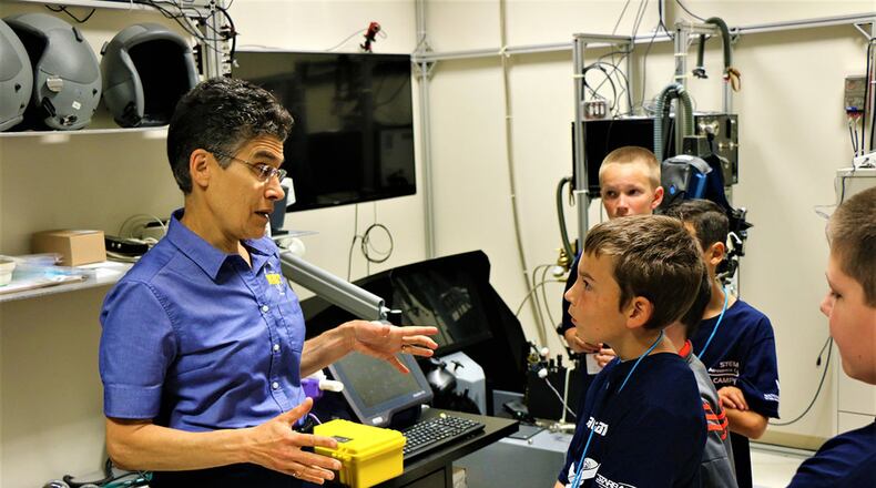 Dr. Barbara Shykoff, senior research engineer, answers questions from STARBASE participants during a recent visit to Naval Medical Research Unit-Dayton. Shykoff is standing in the physiology lab, which is where researchers are evaluating the impact of pressure in the aviation environment on the aviator’s respiratory physiology. (Contributed photo)