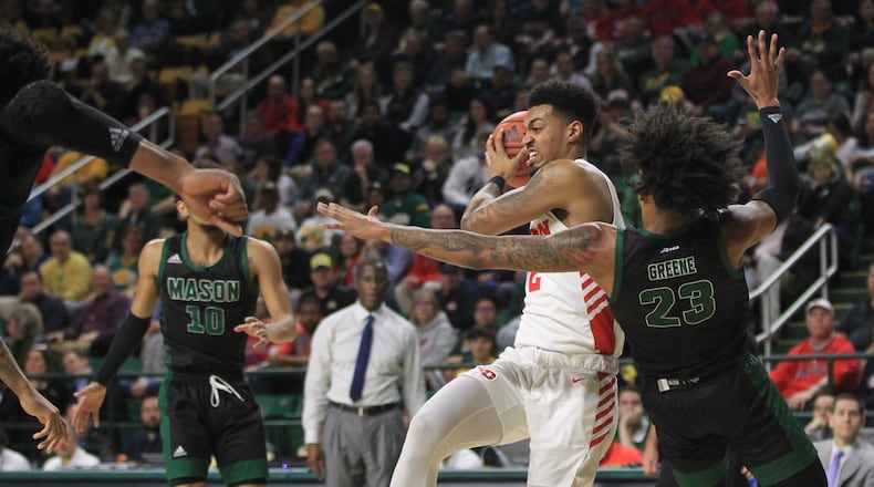 Dayton's Ibi Watson dribbles against George Mason on Tuesday, Feb. 25, 2020, at EagleBank Arena in Fairfax, Va.