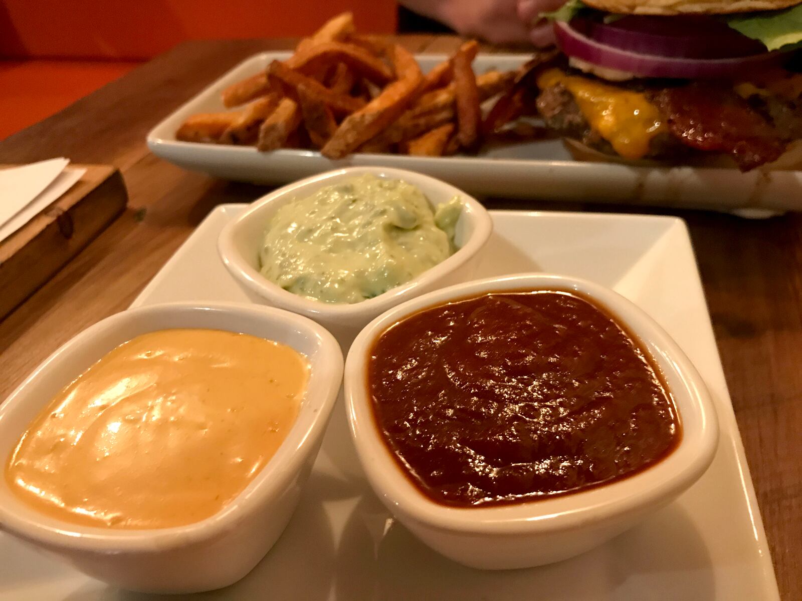 The food at Lock 27 in downtown Dayton.  Pictured: Lock 27's sage pesto mayo, chipotle ketchup and spicy mustard. Photo by Amelia Robinson