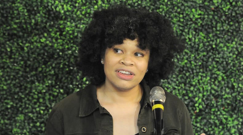 Bethany Ramsey, owner of Puff Apothecary in the Oregon District, talks during a press conference at Lily’s Bistro about the events that happened last Saturday. MARSHALL GORBYSTAFF