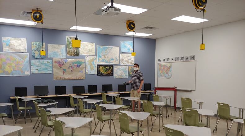 Dayton Regional STEM School social studies teacher Nick Pant prepares in his classroom for the new school year. CONTRIBUTED
