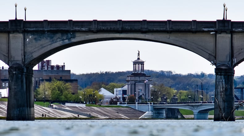 The High-Main Bridge and Soldiers, Sailors and Pioneers Monument is visible under the arches of the Black Street Bridge Wednesday, April 22, 2020 in Hamilton. View looking along the Great Miami River From Combs Park. NICK GRAHAM / STAFF
