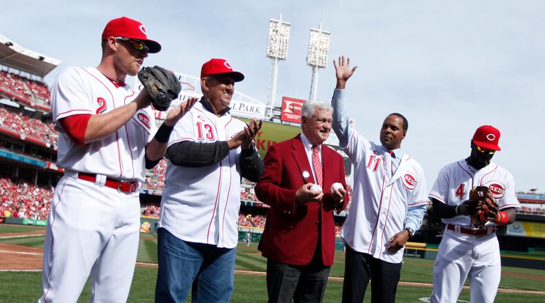 Reds shortstop Zack Cozart, former Red Dave Concepcion, owner Bob Castellini, former Red Barry Larkin and second baseman Brandon Phillips are introduced before a game against the Cardinals on Opening Day at Great American Ball Park on Monday, March 31, 2014, in Cincinnati. David Jablonski/Staff