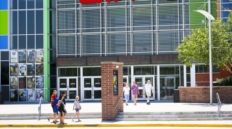 Movie goers leave the AMC West Chester 18 movie theater after an afternoon showing, Friday, July 24, 2015. GREG LYNCH / STAFF