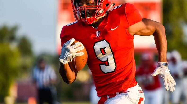 Fairfield’s Jutahn McClain carries the football in for a touchdown during their game Friday, Sept. 14 at Fairfield Stadium. Fairfield won 37-3. NICK GRAHAM/STAFF