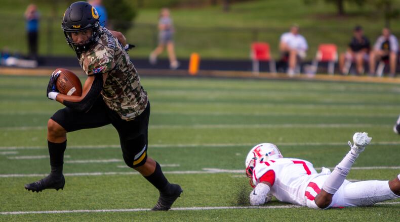 Centerville's Emable Wakilongo rushed for 192 yards and two touchdowns in Friday night's season-opening win over Fairfield. Jeff Gilbert/CONTRIBUTED