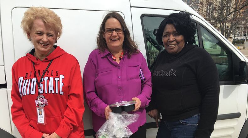 (Left to right) Meals on Wheels driver Carol Dietrich, director of nutrition Sharon Howard, and driver supervisor Mary Washington get together after the deliveries are finished Friday afternoon. Staff photo / Sarah Franks