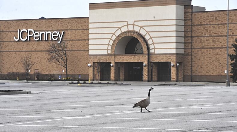 A goose walks across the empty parking lot at the Mall at Fairfield Commons Tuesday. The mall is temporarily closed due to the spread of COVID-19. MARSHALL GORBYSTAFF