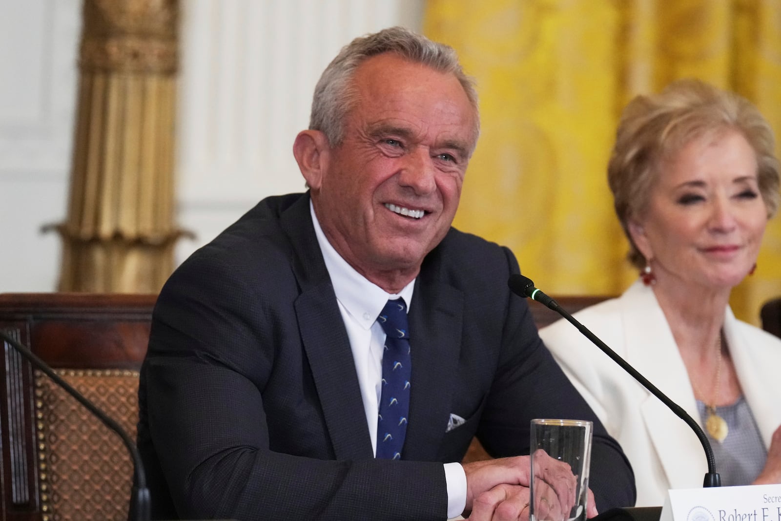 Health and Human Services Secretary Robert F. Kennedy Jr., left, and Education Secretary Linda McMahon attend a Make America Healthy Again (MAHA) Commission Event in the East Room of the White House, Thursday, May 22, 2025, in Washington. (AP Photo/Jacquelyn Martin)