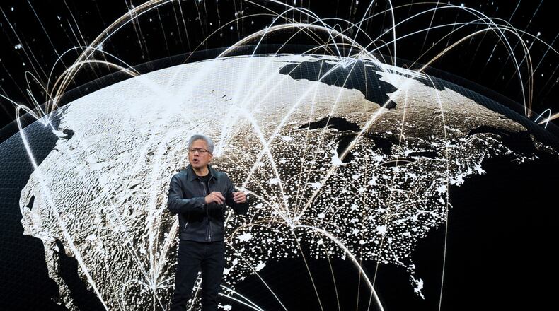 NVIDIA CEO Jensen Huang speaks on how AI infrastructure and AI factories that generate intelligence at scale are powering a new industrial revolution, at Washington Convention Center, Tuesday, Oct. 28, 2025, in Washington. (AP Photo/Manuel Balce Ceneta)