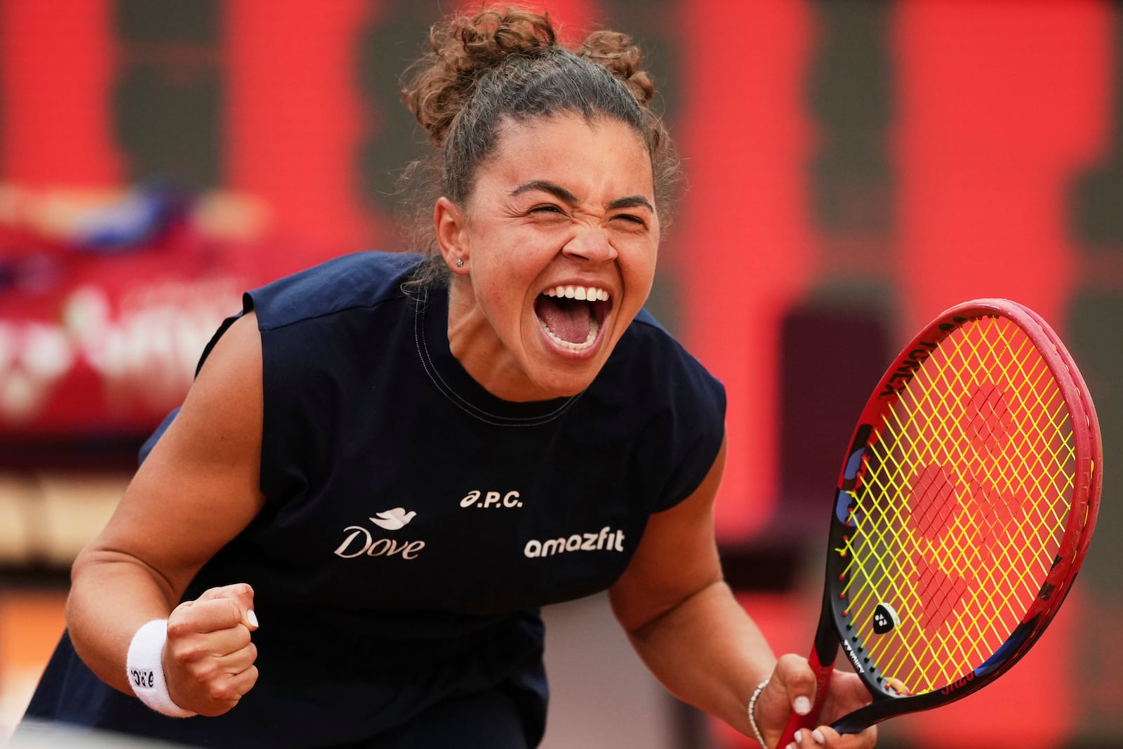 Jasmine Paolini of Italy, reacts after defeating Coco Gauff of the United States during their final tennis match in the Italian Open at the Foro Italico in Rome, Saturday, May 17, 2025. (AP Photo/Alessandra Tarantino)