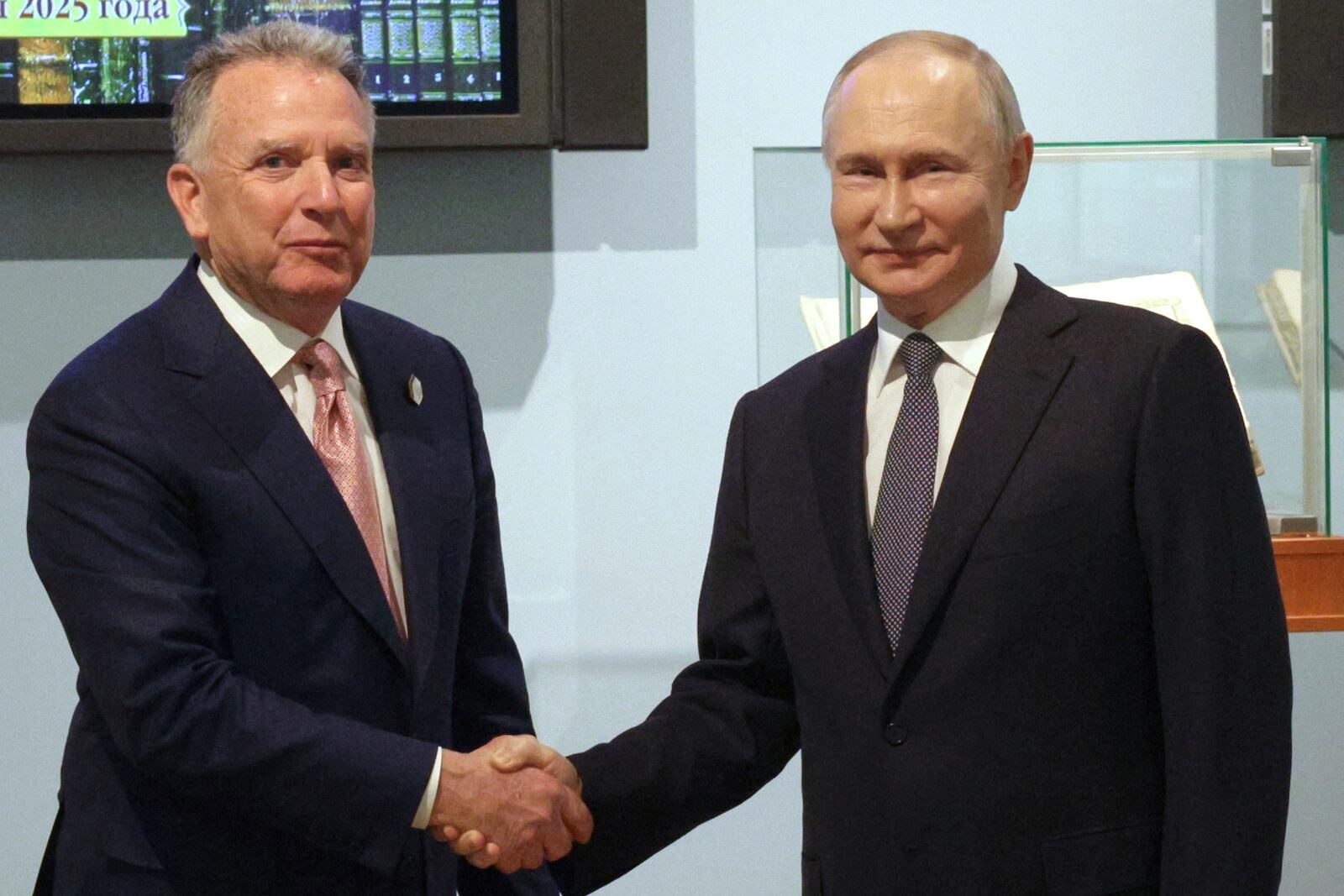 Russian President Vladimir Putin, right, and U.S. President Donald Trump's special envoy Steve Witkoff shake hands prior to their talks in St. Petersburg, Russia, Friday, April 11, 2025. (Gavriil Grigorov, Sputnik, Kremlin Pool Photo via AP)
