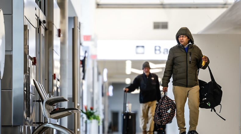 Travelers at the Dayton International Airport walk to the TSA check point in 2022. FILE