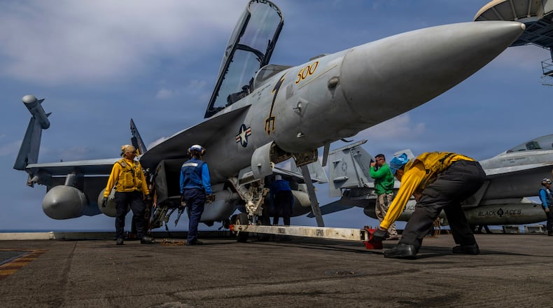 This photo provided by the U.S. Navy shows sailors preparing a Boeing EA-18G Growler on the flight deck of the Nimitz-class aircraft carrier USS Abraham Lincoln in the Indian Ocean on Jan. 21, 2026. (Mass Communication Specialist Seaman Daniel Kimmelman/U.S. Navy via AP)
