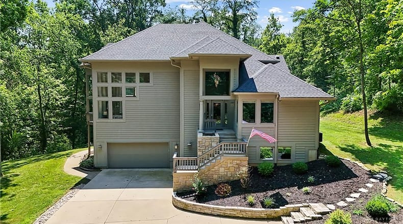 This stone and cedar two has a finished walk out basement and sits on nearly a six acre wooded lot in Sugarcreek Township. CONTRIBUTED