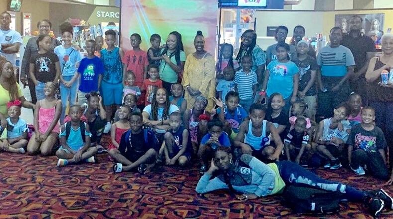 A hundred local children and 34 adult chaperons attended a free screening of "The Lion King."  The event was part of a partnership between Dayton Young Black Professionals,  McKinley United Methodist Church, The Dayton Foundation, CityWide Development Corporation and the Gem City Market.
