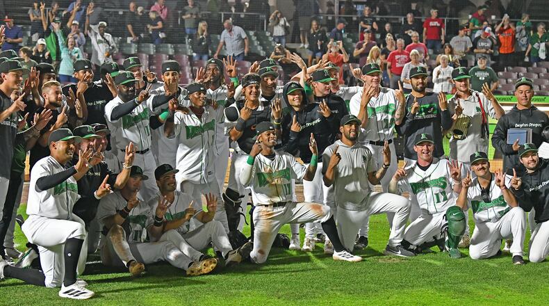 The Dragons signal 1-4 to celebrate their club record 14-game winning streak Tuesday night at Day Air Ballpark after rallying in the eighth inning to defeat Lansing 4-3. JEFF GILBERT/CONTRIBUTED