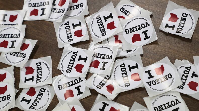 “I Love Voting” stickers wait for voters as they exit a Springfield election poll in 2020. BILL LACKEY/STAFF