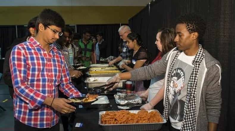 Students load up plates full of food at Raidersgiving at Wright State. The event is an annual Thanksgiving Day celebration that started on campus in 2012. SUBMITTED