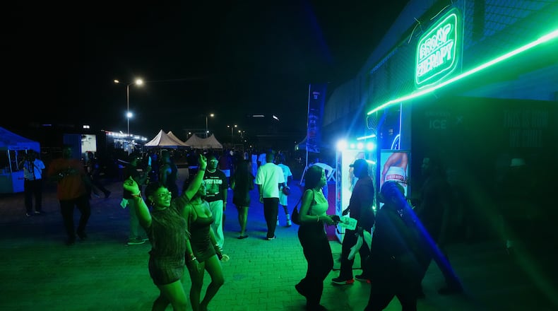 People arrive for a Group Therapy rave in Lekki, an upscale part of Lagos, Nigeria, early Saturday, Feb. 28, 2026. (AP Photo/Sunday Alamba)