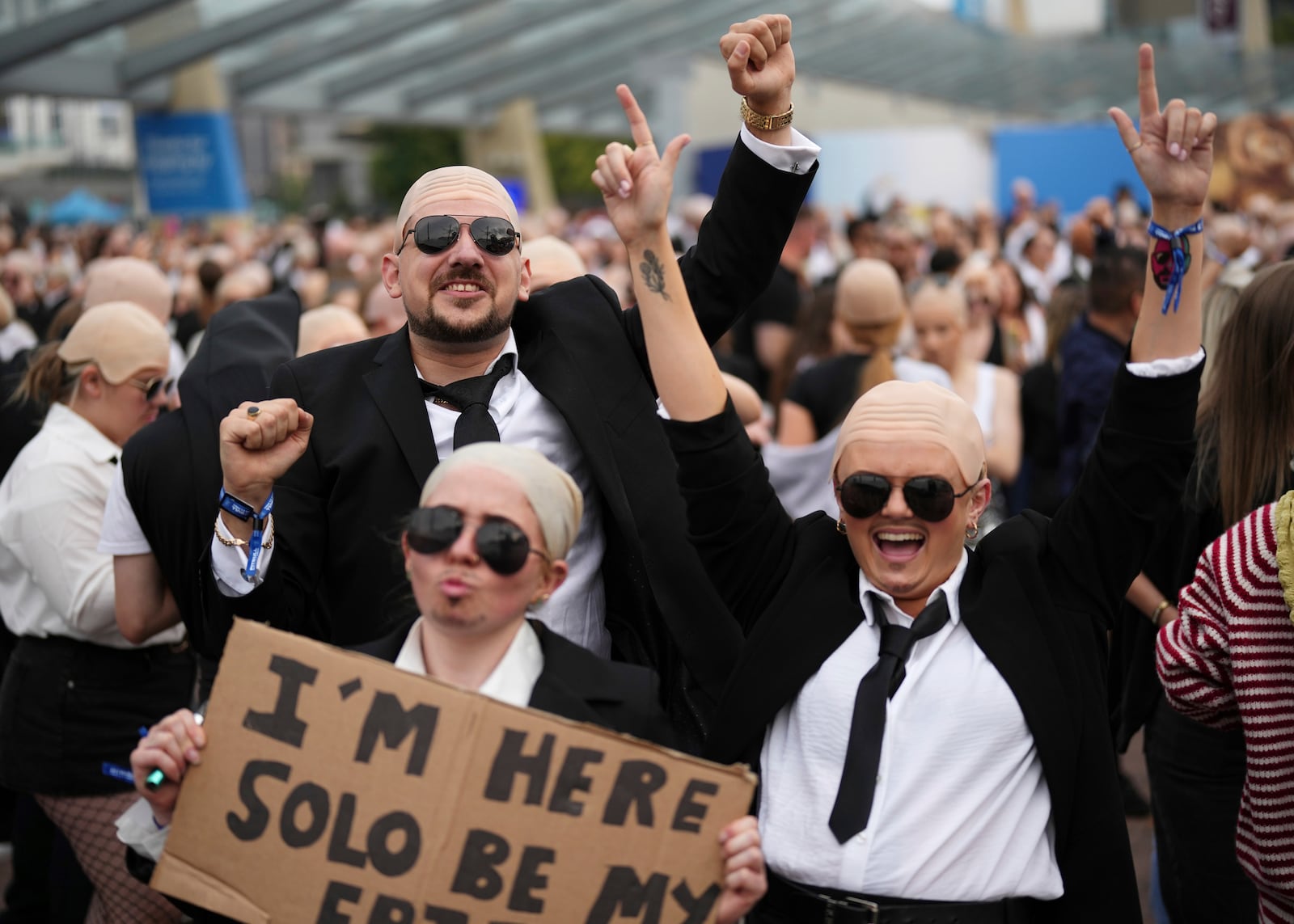 Fans gather in front of the O2 Arena prior to a performance by Pitbull on Monday, June 9, 2025, in London. (Photo by Scott A Garfitt/Invision/AP)
