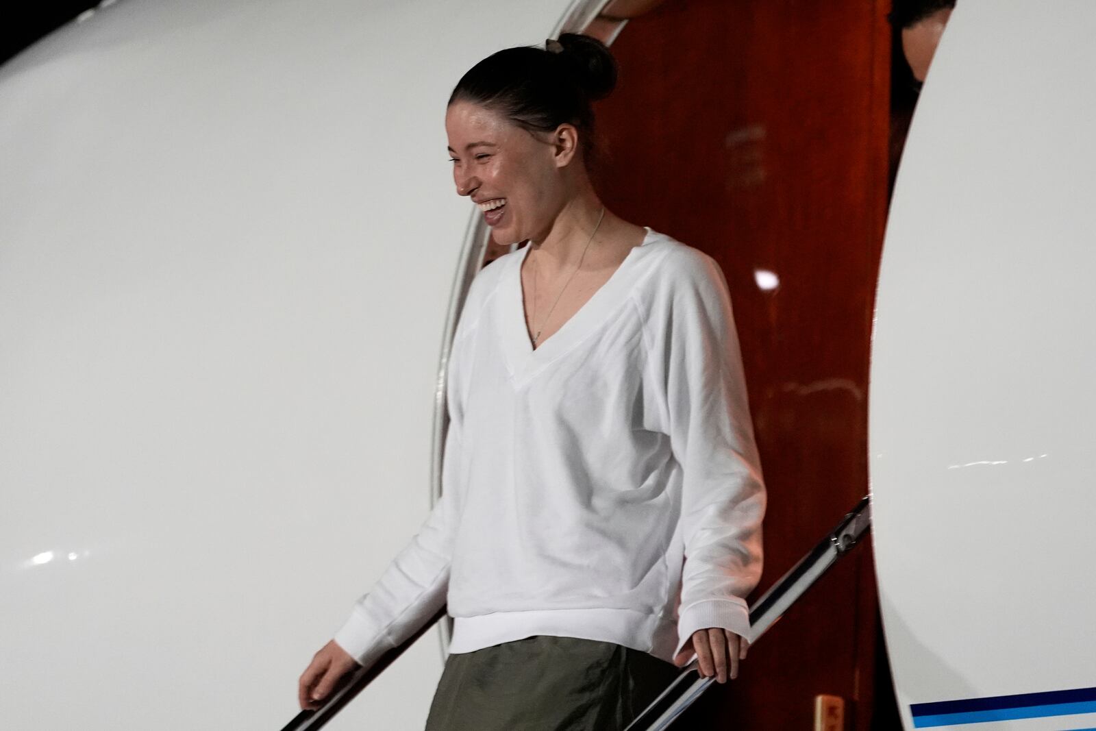 Ksenia Karelina arrives Thursday, April 10, 2025, at Joint Base Andrews, Md. (AP Photo/Alex Brandon)