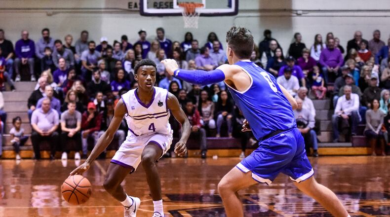 Middletown’s Aaron Jones is defended by Payton Pennington of Hamilton during the final varsity game at Wade E. Miller Gym in Middletown on Dec. 8. NICK GRAHAM/STAFF