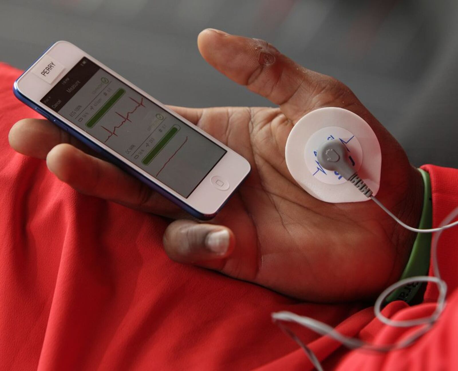 In this Sept. 16, 2015, photo, Ohio State linebacker Joshua Perry watches the results of his daily biometrics monitoring before practice in Columbus, Ohio. Ohio State uses the device to track overall physiological readiness of players and how they hold up to the wear and tear of football. (AP Photo/Jay LaPrete)