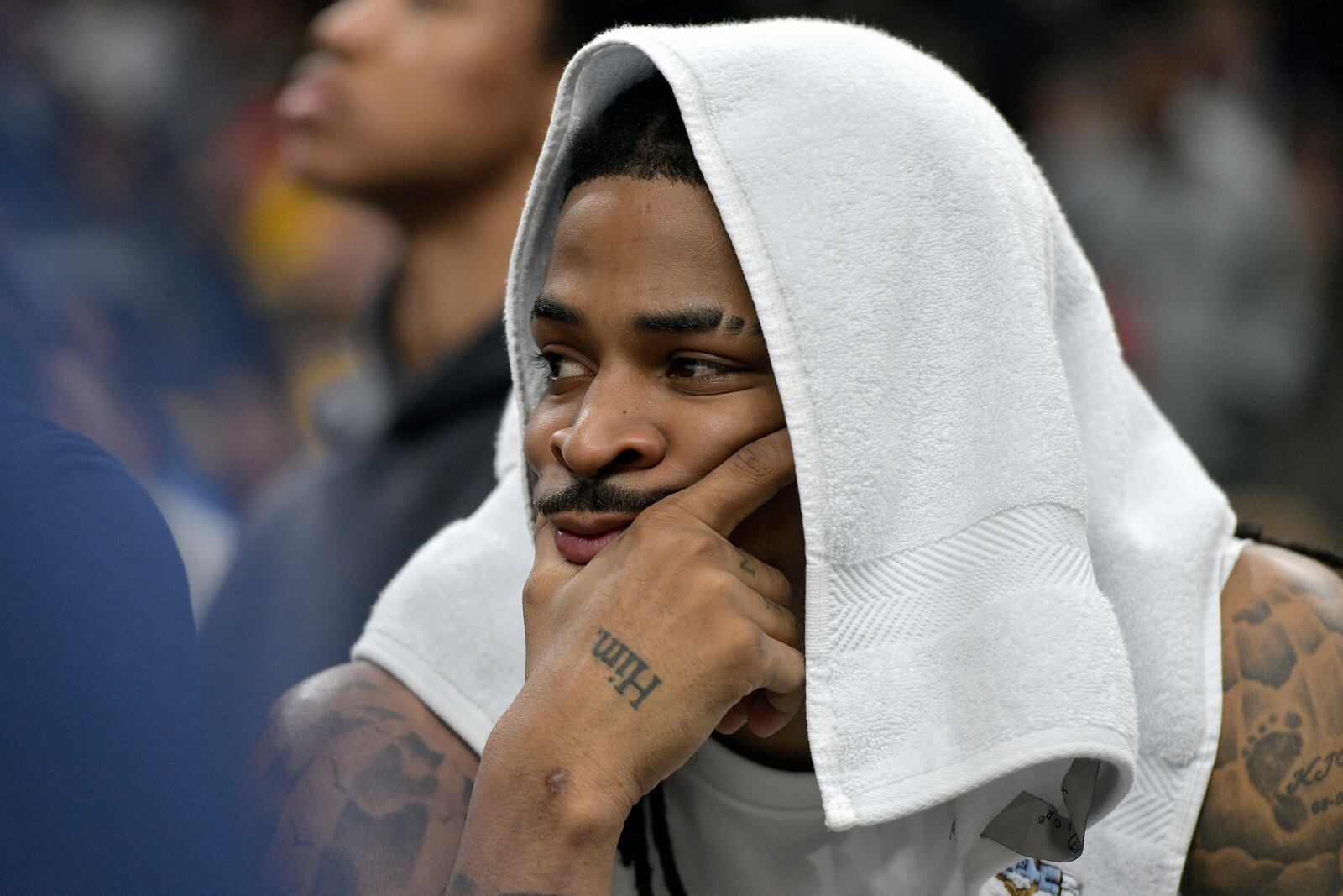 Memphis Grizzlies guard Ja Morant looks on from the bench in the first half of Game 3 of an NBA first-round playoff series against the Oklahoma City Thunder, Thursday, April 24, 2025, in Memphis, Tenn. (AP Photo/Brandon Dill)