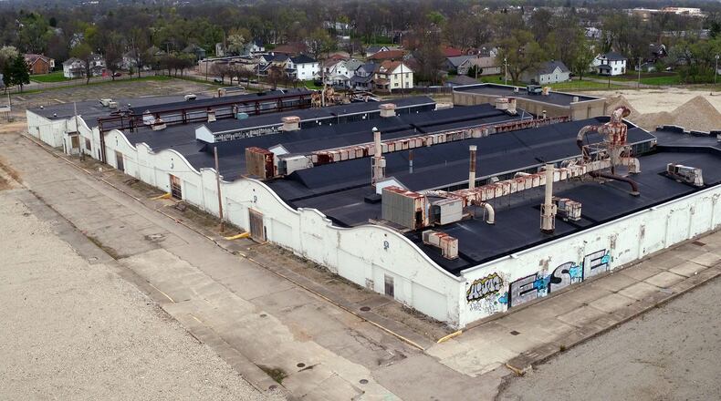 Wilbur and Orville Wright opened the first airplane factory in the country in 1911 inside part of this building along Abbey Avenue in Dayton. The two buildings were duplicated and expanded for auto parts construction that ended with Delphi in 2008. Redevelopment of the historic buildings and surrounding 54 acres have progressed little since the site was cleared of other Delphi buildings in 2014. TY GREENLEES / STAFF