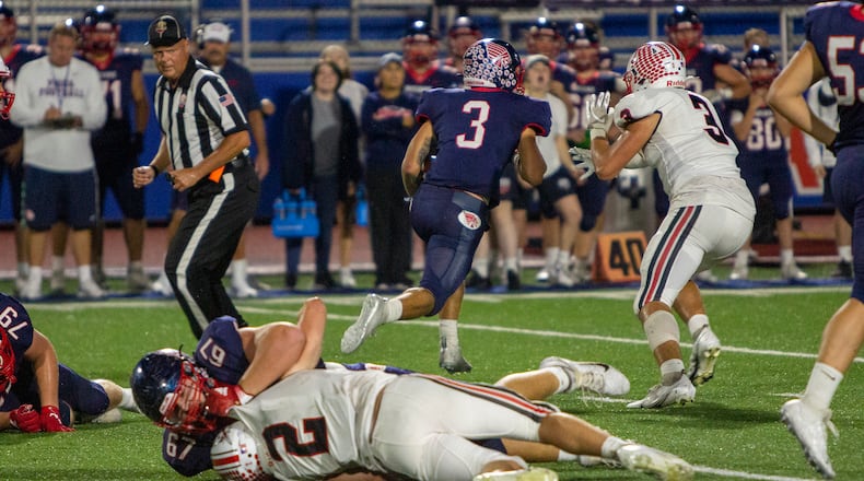 Piqua running back Jasiah Medley breaks free and away from Tippecanoe's Cole Coppock on a 56-yard run in the second quarter Friday night that set up the Indians' third touchdown. Jeff Gilbert/CONTRIBUTED