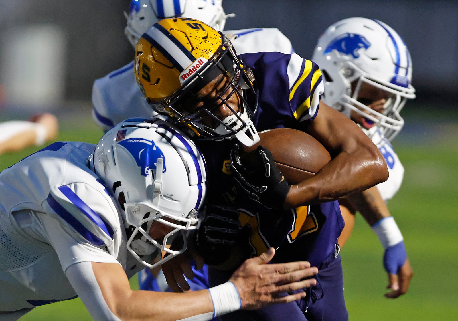Springfield's Amileo Norvell is pushed out of bounds, Evan Weinberg as he carries the ball. BILL LACKEY/STAFF
