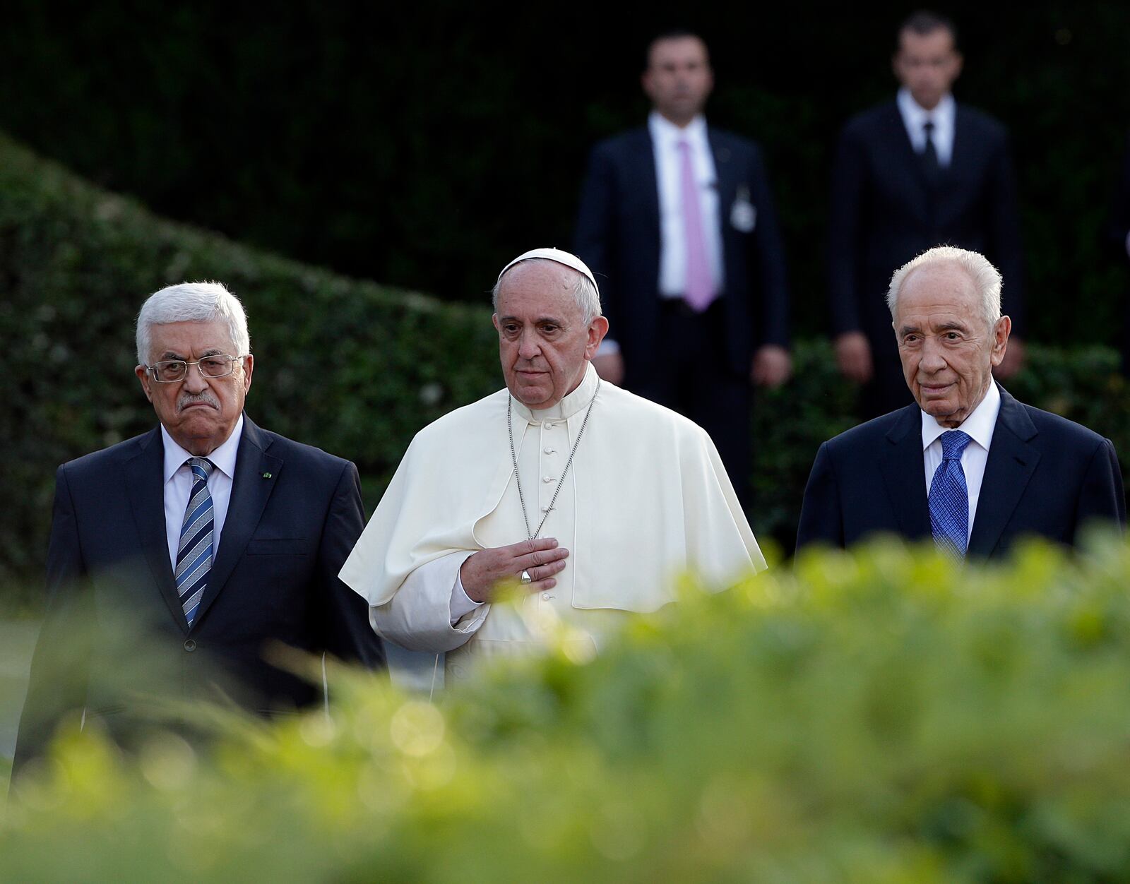 FILE - Pope Francis is flanked by Israel's President Shimon Peres, right, and Palestinian President Mahmoud Abbas during an evening of peace prayers in the Vatican gardens, Sunday, June 8, 2014. (AP Photo/Gregorio Borgia, File)