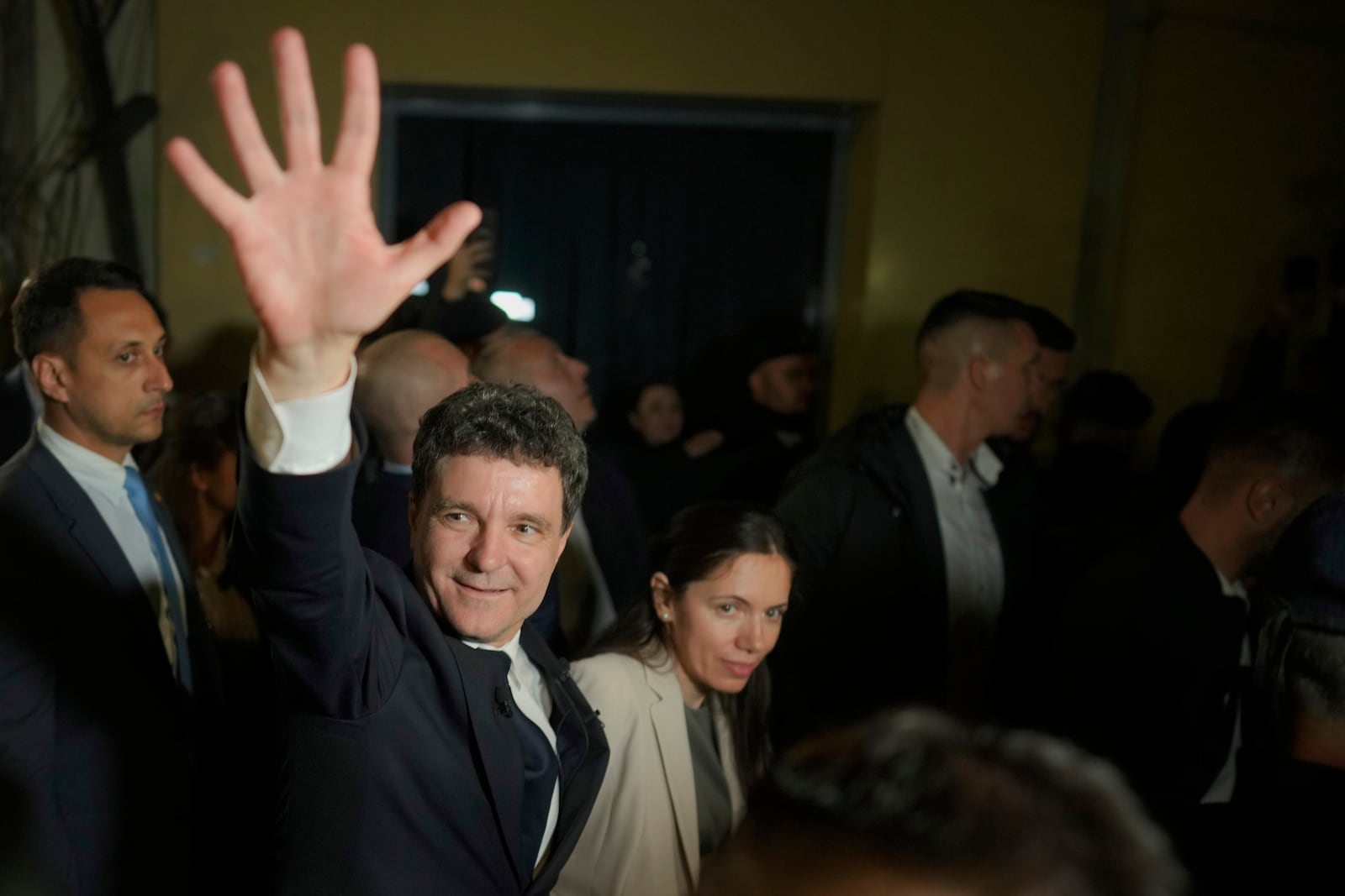 Presidential candidate Nicusor Dan waves to his supporters after polls closed for the second round of the country's presidential election redo in Bucharest, Romania, early Monday, May 19, 2025. (AP Photo/Vadim Ghirda)