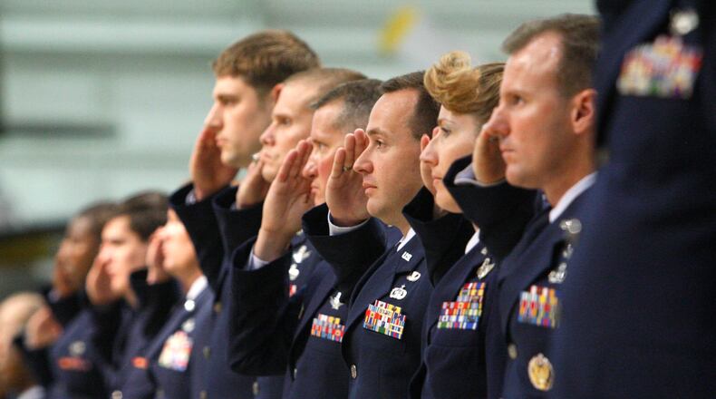 U.S. Air Force personnel who work at the National Air and Space Intelligence Center (NASIC) make their first salute to then-incoming NASIC Commander Col. D. Scott George during a change-of-command ceremony at the National Museum of the United States Air Force in this 2008 photo. Staff photo by Ty Greenlees