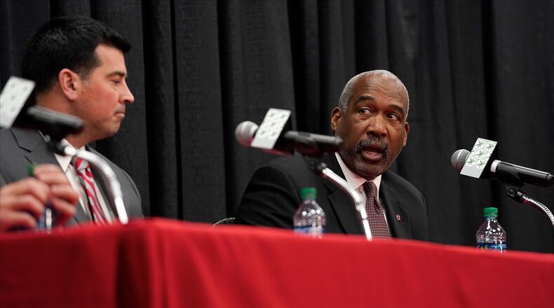 COLUMBUS, OH - DECEMBER 04: Offensive coordinator Ryan Day of the Ohio State Buckeyes listens as athletics director Gene Smith answers a question during a press conference at Ohio State University on December 4, 2018 in Columbus, Ohio. At the press conference head coach Urban Meyer announced his retirement and Day was announced as the next head coach. Meyer will continue to coach until after the Ohio State Buckeyes play in the Rose Bowl. (Photo by Kirk Irwin/Getty Images)