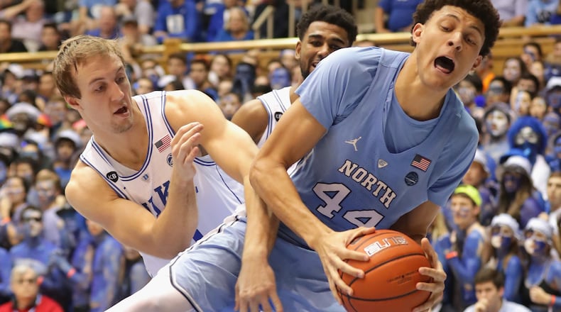 DURHAM, NC - FEBRUARY 09: Luke Kennard #5 of the Duke Blue Devils battles for a loose ball against Justin Jackson #44 of the North Carolina Tar Heels during their game at Cameron Indoor Stadium on February 9, 2017 in Durham, North Carolina. (Photo by Streeter Lecka/Getty Images)