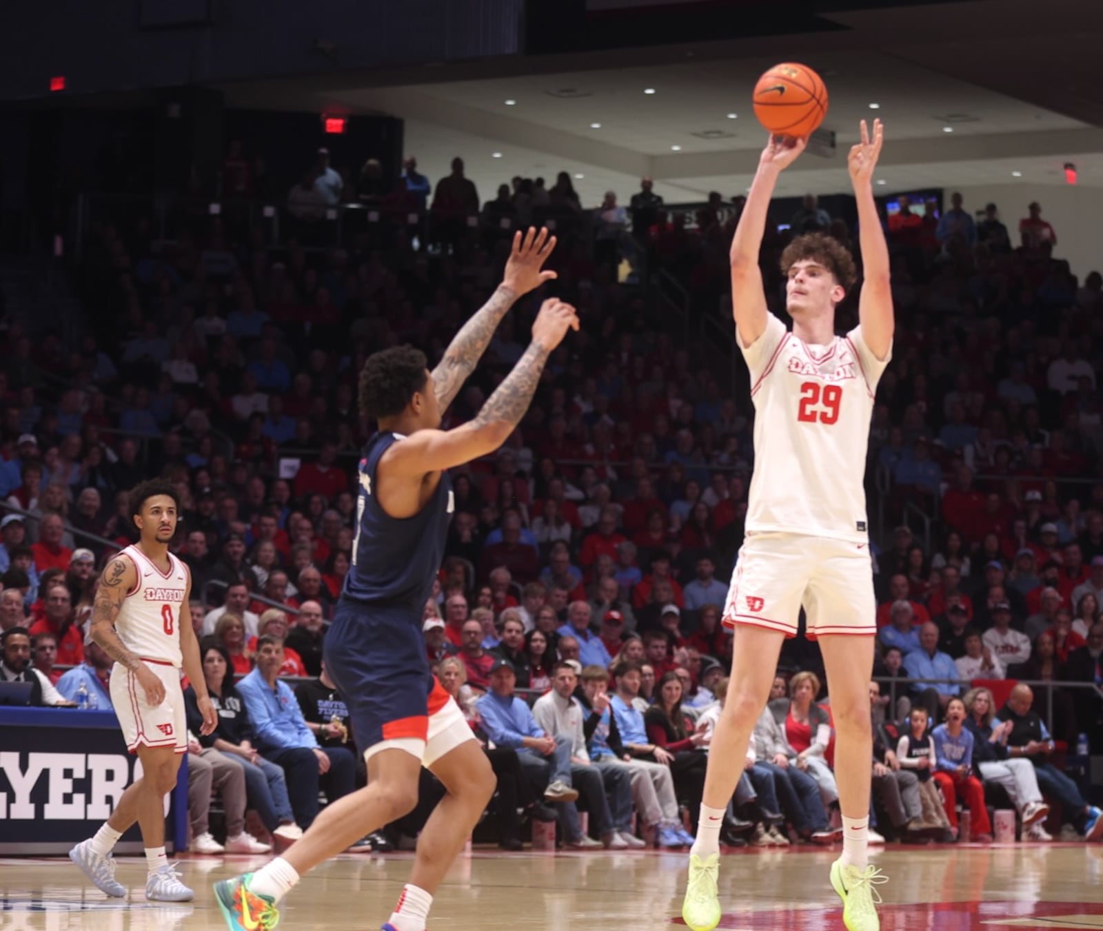 Dayton's Amaël L'Etang makes a 3-pointer in the first half against Duquesne on Saturday, Feb. 21, 2026, at UD Arena. David Jablonski/Staff