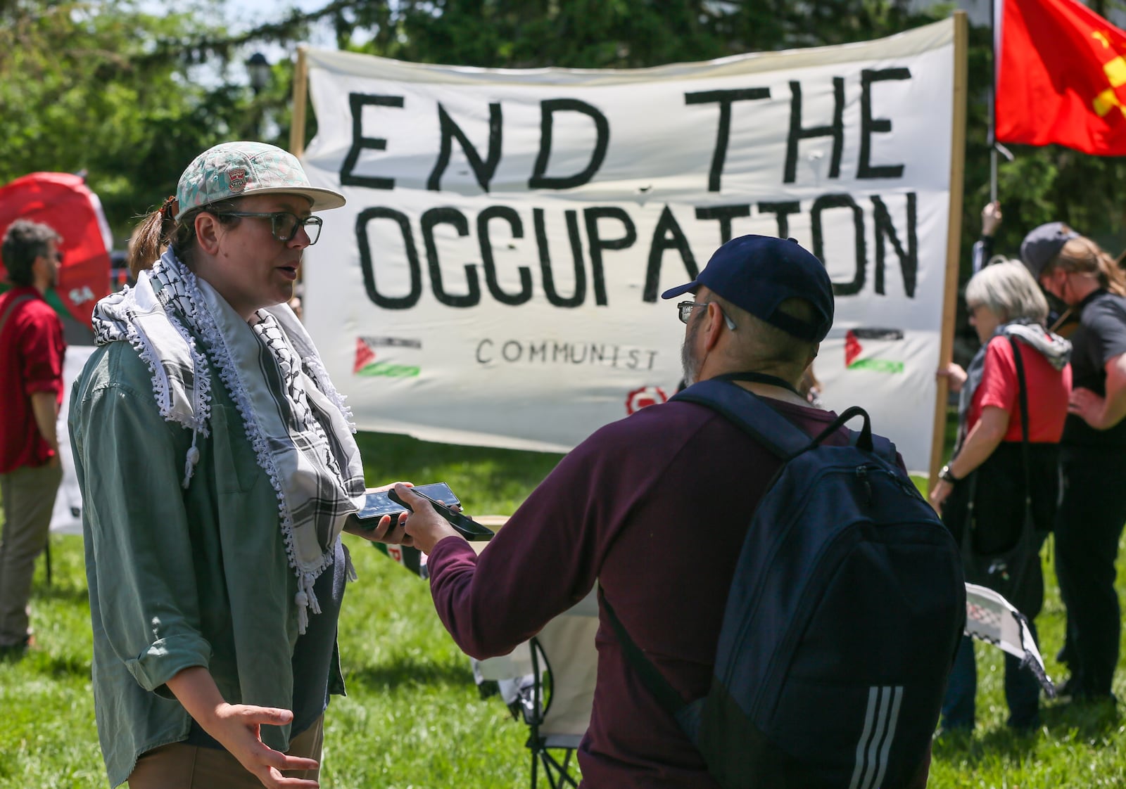 Scenes from protesters at Cooper Park during the NATO Parliamentary Assembly in Dayton, Saturday, May 24, 2025. GREG LYNCH/STAFF